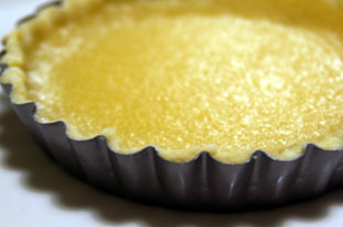 Lemon tart cooling in pan